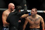 LOS ANGELES, CA - OCTOBER 24:  UFC fighter Cain Velasquez (R) reacts as the referee calls the bout against UFC fighter Ben Rothwell (L) during their Heavyweight bout at UFC 104: Machida vs. Shogun at Staples Center on October 24, 2009 in Los Angeles, California.  Velasquez won the fight by way of TKO.  (Photo by Jon Kopaloff/Getty Images)