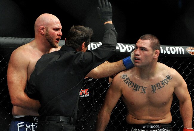 LOS ANGELES, CA - OCTOBER 24:  UFC fighter Cain Velasquez (R) reacts as the referee calls the bout against UFC fighter Ben Rothwell (L) during their Heavyweight bout at UFC 104: Machida vs. Shogun at Staples Center on October 24, 2009 in Los Angeles, California.  Velasquez won the fight by way of TKO.  (Photo by Jon Kopaloff/Getty Images)