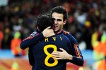 JOHANNESBURG, SOUTH AFRICA - JULY 11:  Xavi Hernandez and Francesc Fabregas of Spain celebrate winning the World Cup during the 2010 FIFA World Cup South Africa Final match between Netherlands and Spain at Soccer City Stadium on July 11, 2010 in Johannesburg, South Africa.  (Photo by Jamie McDonald/Getty Images)