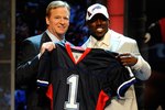 NEW YORK - APRIL 22:  C.J. Spiller from the Clemson Tigers poses with NFL Commissioner Roger Goodell as they hold up a Buffalo Bills jersey after Spiller was selected number 9 overall by the Bills during the first round of the 2010 NFL Draft at Radio City Music Hall on April 22, 2010 in New York City.  (Photo by Jeff Zelevansky/Getty Images)