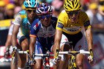 AX 3 DOMAINES, FRANCE - JULY 18:  Race leader Andy Schleck of Luxembourg and Team Saxo Bank leads Joaquin Rodriguez of Spain and Team Katusha and Alberto Contador of Spain and the Astana Team over the finish line during stage fourteen of the 2010 Tour de France from Revel to Ax 3 Domaines on July 18, 2010 in Ax 3 Domaines, France.  (Photo by Bryn Lennon/Getty Images)