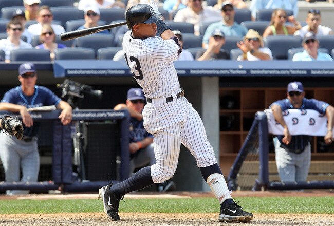 NEW YORK - JULY 18:  Alex Rodriguez #13 of the New York Yankees follows through on a RBI single in the fifth inning against the Tampa Bay Rays on July 18, 2010 at Yankee Stadium in the Bronx borough of New York City.  (Photo by Jim McIsaac/Getty Images)
