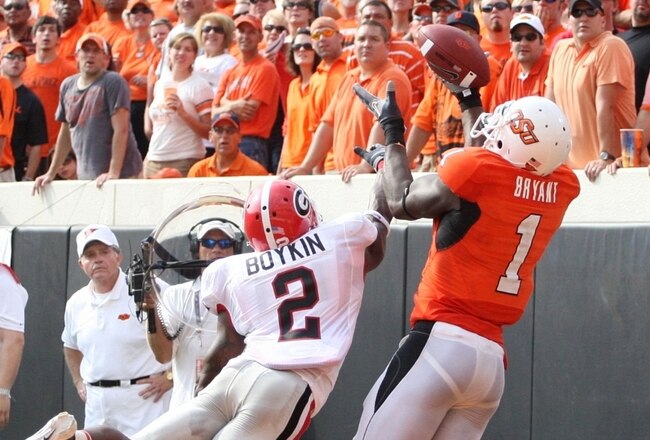 STILLWATER, OK - SEPTEMBER 5:  Runningback Brandon Boykin #2 of the Georgia Bulldogs dives for the ball for the ball as Dez Bryant #1 of the Oklahoma State Cowboys cannot make the pass during the third quarter of the game at Boone Pickens Stadium on September 5, 2009 in Stillwater, Oklahoma. (Photo by Christian Petersen/Getty Images)