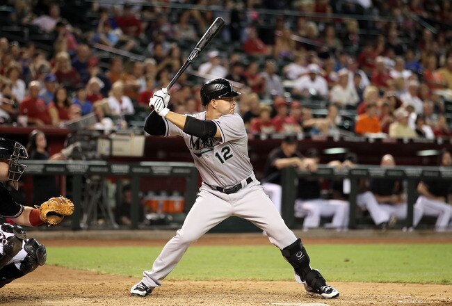PHOENIX - JULY 10:  Cody Ross #12 of the Florida Marlins bats against the Arizona Diamondbacks during the Major League Baseball game at Chase Field on July 10, 2010 in Phoenix, Arizona.  (Photo by Christian Petersen/Getty Images)