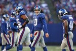EAST RUTHERFORD, NJ - DECEMBER 27:  Eli Manning #10 of the New York Giants walks from the field  against the Carolina Panthers at Giants Stadium on December 27, 2009 in East Rutherford, New Jersey.  (Photo by Nick Laham/Getty Images)