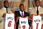 MIAMI - JULY 09:  LeBron James #6, Dwyane Wade #3 and Chris Bosh #1 of the Miami Heat show off their new game jerseys before a press conference after a welcome party at American Airlines Arena on July 9, 2010 in Miami, Florida.  (Photo by Doug Benc/Getty Images)
