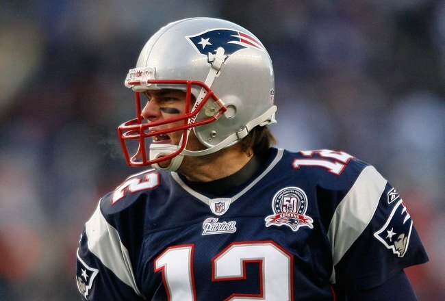 FOXBORO, MA - JANUARY 10:  Tom Brady #12 of the New England Patriots reacts against the Baltimore Ravens during the 2010 AFC wild-card playoff game at Gillette Stadium on January 10, 2010 in Foxboro, Massachusetts. The Ravens won 33-14. (Photo by Elsa/Getty Images)