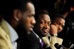 MIAMI - JULY 09:  Dwyane Wade #3 (C) of the Miami Heat talks during a press conference after a welcome party at American Airlines Arena on July 9, 2010 in Miami, Florida.  (Photo by Doug Benc/Getty Images)