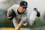 LOS ANGELES, CA - JUNE 03:   Jeff Francis #26 of the Colorado Rockies pitches against the Los Angeles Dodgers at Dodger Stadium on June 3, 2008 in Los Angeles, California.  (Photo by Lisa Blumenfeld/Getty Images)