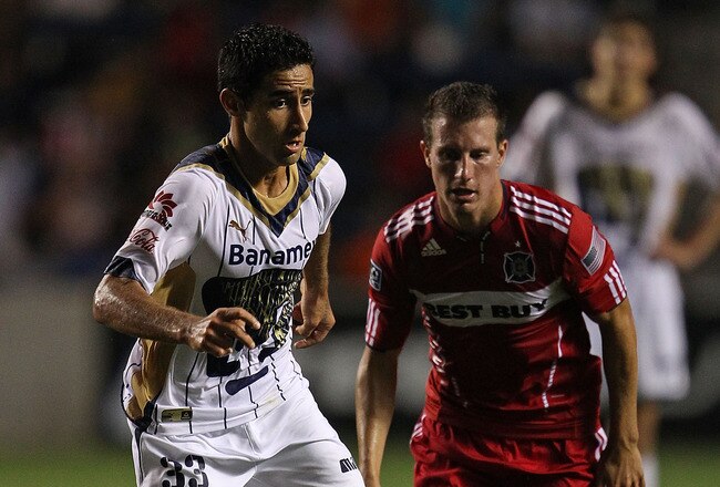 BRIDGEVIEW, IL - JULY 20: Luis Fuentes #33 of Pumas UNAM scrambles up the field pursued by Corben Bone #19 of the Chicago Fire during a SuperLiga 2010 match at Toyota Park on July 20, 2010 in Bridgeview, Illinois. The Fire defeated Pumas UNAM 1-0. (Photo by Jonathan Daniel/Getty Images)