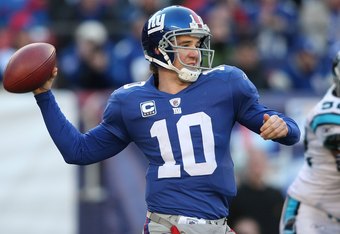 EAST RUTHERFORD, NJ - DECEMBER 27:  Eli Manning #10 of the New York Giants against the Carolina Panthers at Giants Stadium on December 27, 2009 in East Rutherford, New Jersey.  (Photo by Nick Laham/Getty Images)