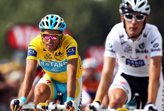 PAU, FRANCE - JULY 20:  Race leader Alberto Contador (l) of Spain and the Astana team rides over the finish line alongside second placed Andy Schleck of Luxembourg and Team Saxo Bank on stage sixteen of the 2010 Tour de France from Bagneres-de-Luchon to Pau on July 20, 2010 in Pau, France.  (Photo by Bryn Lennon/Getty Images)