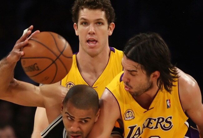 LOS ANGELES, CA - MAY 21:  Ime Udoka #5 of the San Antonio Spurs grabs a loose ball as he is covered by Luke Walton #4 and Sasha Vujacic #18 of the Los Angeles Lakers in the first half of Game One of the Western Conference Finals during the 2008 NBA Playoffs on May 21, 2008 at Staples Center in Los Angeles, California.  NOTE TO USER: User expressly acknowledges and agrees that, by downloading and/or using this Photograph, user is consenting to the terms and conditions of the Getty Images License Agreement.  (Photo by Jeff Gross/Getty Images)