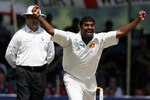 KANDY, SRI LANKA - DECEMBER 03:  Sri Lankan bowler Muttiah Muralitharan celebrates after taking his World Record 709th Test wicket, that of England batsman Paul Collingwood, during the third day of the First Test match between Sri Lanka and England at Asgiriya Stadium on December 3, 2007 in Kandy, Sri Lanka.  (Photo by Stu Forster/Getty Images)