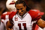 NEW ORLEANS - JANUARY 16:  Larry Fitzgerald #11  of the Arizona Cardinals stands on the sideline with his head down late in the second half against the New Orleans Saints during the NFC Divisional Playoff Game at Louisana Superdome on January 16, 2010 in New Orleans, Louisiana.  (Photo by Ronald Martinez/Getty Images)