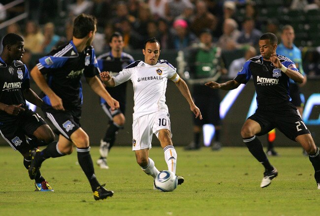 CARSON, CA - JULY 22:  Landon Donovan #10 of the Los Angeles Galaxy plays the ball at midfield between Brandon McDonald #14, Bobby Burling #2 and Jason Hernandez #21 of the San Jose Earthquakes in the second half during their MLS match at The Home Depot Center on July 22, 2010 in Carson, California. The Earthquakes and the Galaxy played to a 2-2 draw.  (Photo by Victor Decolongon/Getty Images)