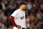 BOSTON - MAY 06:  Manny Delcarmen #17 of the Boston Red Sox reacts after Mike Napoli of the Los Angeles Angels of Anaheim hits a two run homer in the sixth inning on May 6, 2010 at Fenway Park in Boston, Massachusetts.  (Photo by Elsa/Getty Images)