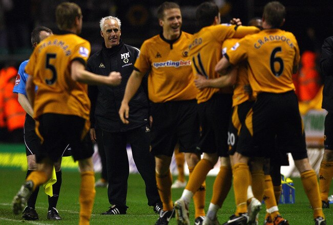 WOLVERHAMPTON, ENGLAND - DECEMBER 05:  Mick McCarthy, manager of Wolverhampton Wanderers looks on, Nenad Milijas of Wolverhampton celebrates his goal during the Barclays Premier League match between Wolverhampton Wanderers and Bolton Wanderers at Molineaux on December 5, 2009 in Wolverhampton, England.  (Photo by Matthew Lewis/Getty Images)