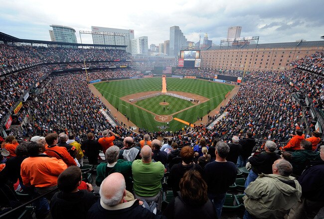 BALTIMORE - APRIL 06:  The Baltimore Orioles and the New York Yankees line up for the National Anthem during opening day on April 6, 2009 at Camden Yards in Baltimore, Maryland.  (Photo by Greg Fiume/Getty Images)