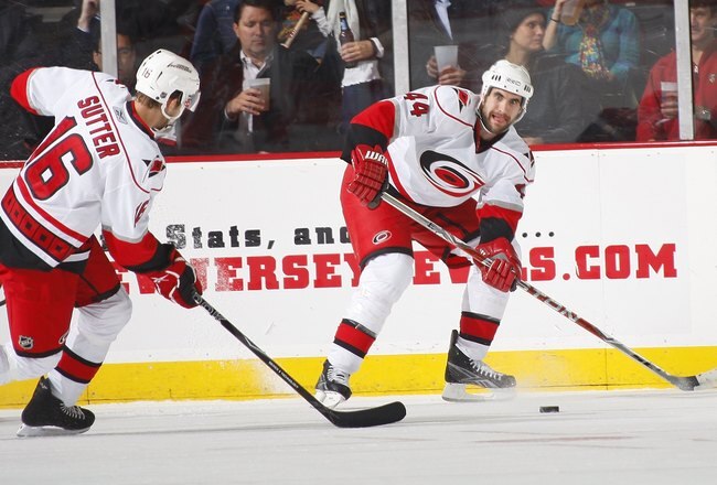 NEWARK, NJ - DECEMBER 09:  Jay Harrison #44 of the Carolina Hurricanes waits for a pass from Brandon Sutter #16 during a hockey game against the New Jersey Devils on December 9, 2009 in Newark, New Jersey.  (Photo by Paul Bereswill/Getty Images)