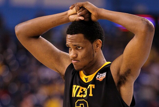 INDIANAPOLIS - APRIL 03:  Devin Ebanks #3 of the West Virginia Mountaineers walks on the court with his hands on his head against the Duke Blue Devils during the National Semifinal game of the 2010 NCAA Division I Men's Basketball Championship at Lucas Oil Stadium on April 3, 2010 in Indianapolis, Indiana.  (Photo by Andy Lyons/Getty Images)
