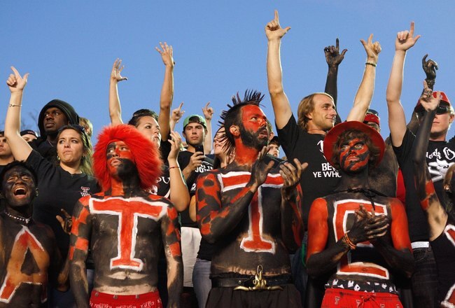 LUBBOCK, TEXAS - NOVEMBER 1:  Fans of the Texas Tech Red Raiders cheer in the stands before the game against the Texas Longhorns on November 1, 2008 at Jones Stadium in Lubbock, Texas. (Photo by: Jamie Squire/Getty Images)