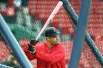 BOSTON - MAY 9:  Mike Lowell #25 of the Boston Red Sox takes batting practice with a pink bat, a symbol to raise breast cancer awareness, before a game against the New York Yankees at Fenway Park on May 9, 2010 in Boston, Massachusetts. On occasion of Mother's Day, the Boston Red Sox have partnered with Major League Baseball to raise breast cancer awareness as part of Major League Baseball's Going to Bat Against Breast Cancer initiative.  (Photo by Jim Rogash/Getty Images)