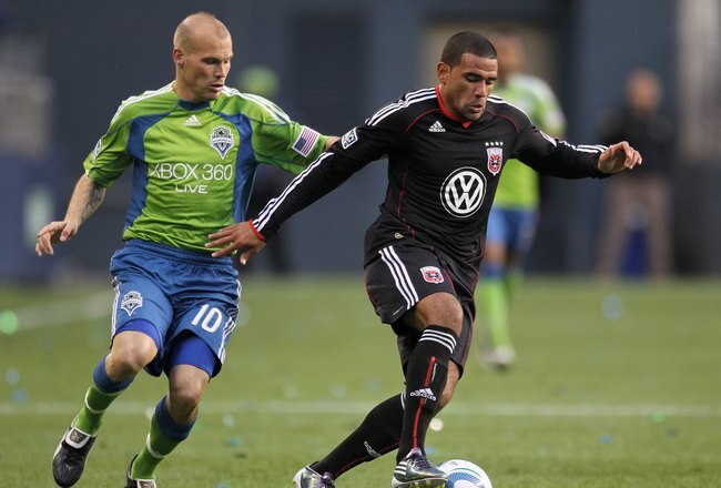 SEATTLE - JUNE 10:  Barry Rice #15 of D.C. United dribbles against Freddie Ljungberg #10 of the Seattle Sounders FC on June 10, 2010 at Qwest Field in Seattle, Washington. (Photo by Otto Greule Jr/Getty Images)