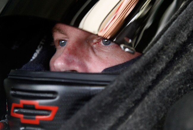 INDIANAPOLIS - JULY 23:  Dale Earnhardt Jr., driver of the #88 AMP Energy/National Guard Chevrolet, in his car in the garage during practice for the NASCAR Sprint Cup Series Brickyard 400 at Indianapolis Motor Speedway on July 23, 2010 in Indianapolis, Indiana.  (Photo by Jason Smith/Getty Images)