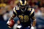 ST. LOUIS - NOVEMBER 29:  Steven Jackson #39 of the St. Louis Rams runs with the ball for yardage against the Seattle Seahawks during their NFL game at Edward Jones Dome on November 29, 2009 in St. Louis, Missouri. The Seahawks defeated the Rams 27-17.  (Photo by Dilip Vishwanat/Getty Images)