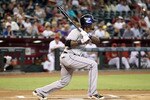 PHOENIX - JULY 20:  Jose Reyes #7 of the New York Mets hits a single agianst the Arizona Diamondbacks during the first inning of the Major League Baseball game at Chase Field on July 20, 2010 in Phoenix, Arizona.  (Photo by Christian Petersen/Getty Images)
