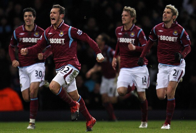 LONDON, ENGLAND - FEBRUARY 10:  Alessandro Diamanti of West Ham United (#32) celebrates with his team-mates after scoring the first goal for West Ham United during the Barclays Premier League match between West Ham United and Birmingham City at Boleyn Ground on February 10, 2010 in London, England.  (Photo by Paul Gilham/Getty Images)