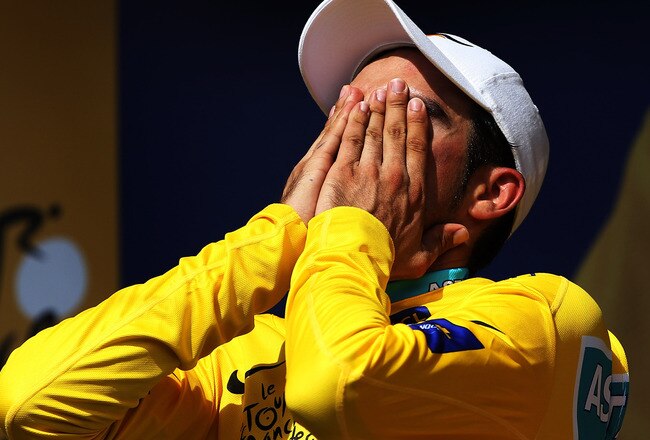 PAUILLAC, FRANCE - JULY 24:  Alberto Contador of Spain and the Astana Team reacts on the podium after retaining his yellow jersey on stage nineteen, a 52km individual time trial from Bordeaux to Pauillac, on July 24, 2010 in Pauillac, France.  (Photo by Bryn Lennon/Getty Images)