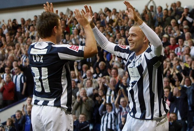 WEST BROMWICH, ENGLAND - APRIL 17: Roman Bedner (R) of West Bromwich Albion celebrates scoring the second goal with scorer of the opener Simon Cox (L) during the Coca Cola Championship match between West Bromwich Albion and Middlesbrough at The Hawthorns on April 17, 2010 in West Bromwich, England. (Photo by Tom Dulat/Getty Images)