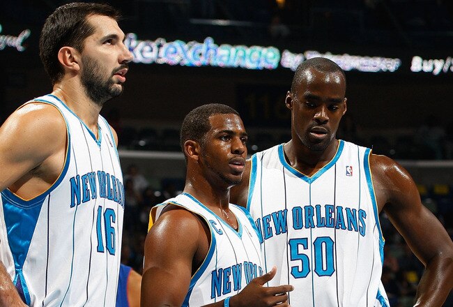 NEW ORLEANS - DECEMBER 16:  Peja Stojakovic #16, Chris Paul #3 Emeka Okafor #50 and Marcus Thornton #5 of the New Orleans Hornets talk  during the game against the Detroit Pistons at New Orleans Arena on December 16, 2009 in New Orleans, Louisiana. The Hornets defeated the Pistons 95-87. NOTE TO USER: User expressly acknowledges and agrees that, by downloading and or using this Photograph, user is consenting to the terms and conditions of the Getty Images License Agreement. Mandatory Copyright Notice: (Photo by Chris Graythen/Getty Images)