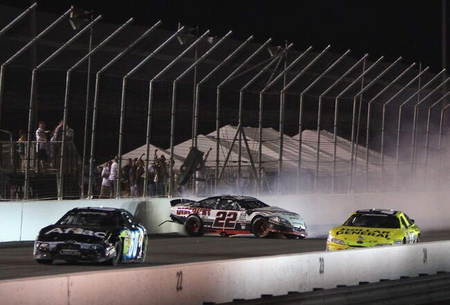 MADISON, IL - JULY 17: Brad Keselowski driver of the #22 Discount Tire Dodge wrecks on the final lap of the NASCAR Nationwide Series Missouri-Illinois Dodge Dealers 250 at Gateway International Raceway on July 17, 2010 in Madison, Illinois.  (Photo by Dilip Vishwanat/Getty Images for NASCAR)