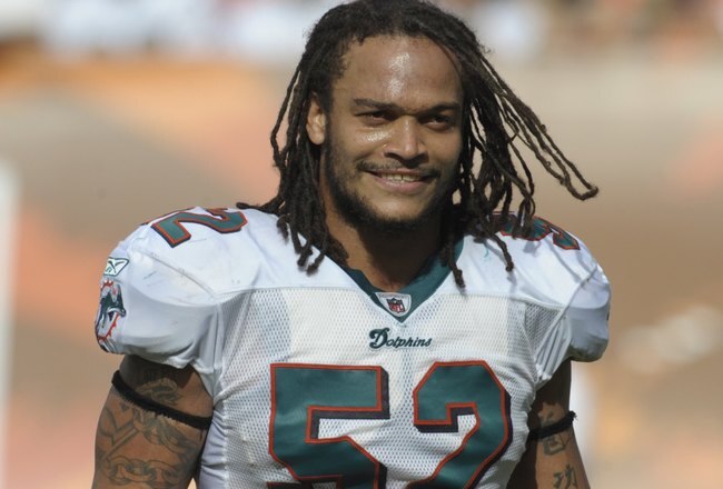 MIAMI, FL - JANUARY 4:  Linebacker Channing Crowder #52 of the Miami Dolphins sets for play against the Baltimore Ravens in an NFL Wildcard Playoff Game at Dolphins Stadium on January 4, 2009 in Miami, Florida.  (Photo by Al Messerschmidt/Getty Images)