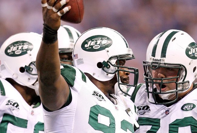 INDIANAPOLIS - DECEMBER 27:  Marques Douglas #93 of the New York Jets celebrates a touchdown during the NFL game against the Indianapolis Colts at Lucas Oil Stadium on December 27, 2009 in Indianapolis, Indiana. Peyton Manning and many of the Colts starters  were pulled from the game in the second half and the Colts went on to lose their first game of the season 29-15.  (Photo by Andy Lyons/Getty Images)