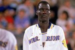 1988:  Manute Bol #10 of the Golden State Warriors walks to the court during an NBA game in the 1988-89 season. NOTE TO USER: User expressly acknowledges and agrees that, by downloading and/or using this Photograph, User is consenting to the terms and conditions of the Getty Images License Agreement. (Photo by: Otto Greule Jr/Getty Images