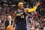 PHOENIX - APRIL 13:  Carmelo Anthony #15 of the Denver Nuggets handles the ball during the NBA game against the Phoenix Suns at US Airways Center on April 13, 2010 in Phoenix, Arizona. The Suns defeated the Nuggets 123-101.  NOTE TO USER: User expressly acknowledges and agrees that, by downloading and or using this photograph, User is consenting to the terms and conditions of the Getty Images License Agreement.  (Photo by Christian Petersen/Getty Images)