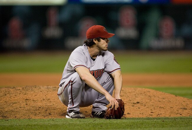 ST. LOUIS - JUNE 28: Dan Haren #15 of the Arizona Diamondbacks reacts to giving up a run-scoring hit against the St. Louis Cardinals at Busch Stadium on June 28, 2010 in St. Louis, Missouri.  The Cardinals beat the Diamondbacks 6-5 in the bottom of the ninth.  (Photo by Dilip Vishwanat/Getty Images)