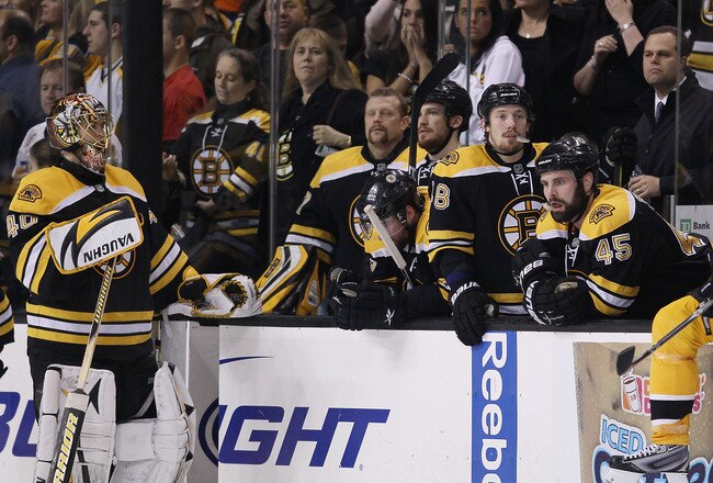 BOSTON - MAY 14:  Tuukka Rask #40 and the rest of the Boston Bruins react as the Philadelphia Flyers celebrate the win in Game Seven of the Eastern Conference Semifinals during the 2010 NHL Stanley Cup Playoffs at TD Garden on May 14, 2010 in Boston, Massachusetts. The Flyers defeated the Bruins 4-3.  (Photo by Elsa/Getty Images)