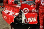 INDIANAPOLIS - JULY 25:  Crew members work on the #42 Target Chevrolet driven by Juan Pablo Montoya after it crashed late in the race during the NASCAR Sprint Cup Series Brickyard 400 at Indianapolis Motor Speedway on July 25, 2010 in Indianapolis, Indiana.  (Photo by Rusty Jarrett/Getty Images for NASCAR)