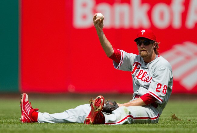 ST. LOUIS - JULY 22: Jayson Werth #28 of the Philadelphia Phillies shows the ball after making a sliding catch against the St. Louis Cardinals at Busch Stadium on July 22, 2010 in St. Louis, Missouri. The Phillies defeated the Cardinals 2-0.  (Photo by Dilip Vishwanat/Getty Images)