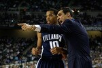 DETROIT - APRIL 04:  Head coach Jay Wright of the Villanova Wildcats gestures as he talks with Corey Fisher #10 in the first half against the North Carolina Tar Heels during the National Semifinal game of the NCAA Division I Men's Basketball Championship at Ford Field on April 4, 2009 in Detroit, Michigan.  (Photo by Andy Lyons/Getty Images)