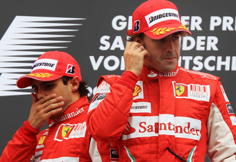 HOCKENHEIM, GERMANY - JULY 25:  Race winner Fernando Alonso (R) of Spain and Ferrari celebrates on the podium with second placed Felipe Massa (L) of Brazil and Ferrari following the German Grand Prix at Hockenheimring on July 25, 2010 in Hockenheim, Germany.  (Photo by Mark Thompson/Getty Images)