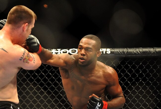 LAS VEGAS - JULY 11:  (R-L) Jon Jones connects with a right punch on Jake O'Brein during their light heavyweight bout during UFC 100 on July 11, 2009 in Las Vegas, Nevada. Jones defeated O'Brein by second round tapout.  (Photo by Jon Kopaloff/Getty Images)