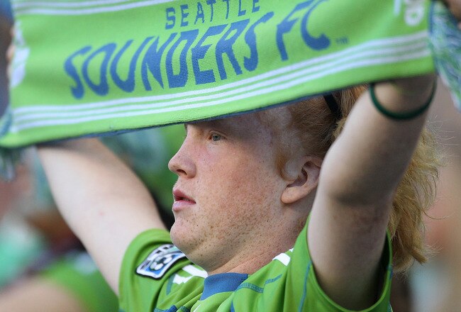 SEATTLE - JULY 25:  A fan of the Seattle Sounders FC holds a sign  during the game against the Colorado Rapids on July 25, 2010 at Qwest Field in Seattle, Washington. The Sounders defeated the Rapids 2-1. (Photo by Otto Greule Jr/Getty Images)