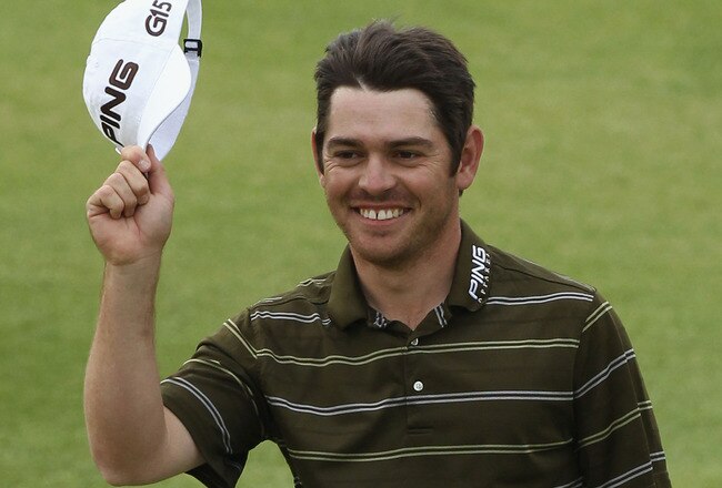 ST ANDREWS, SCOTLAND - JULY 18:  Louis Oosthuizen of South Africa celebrates his seven-stroke victory in the final round of the 139th Open Championship on the Old Course, St Andrews on July 18, 2010 in St Andrews, Scotland.  (Photo by David Cannon/Getty Images)
