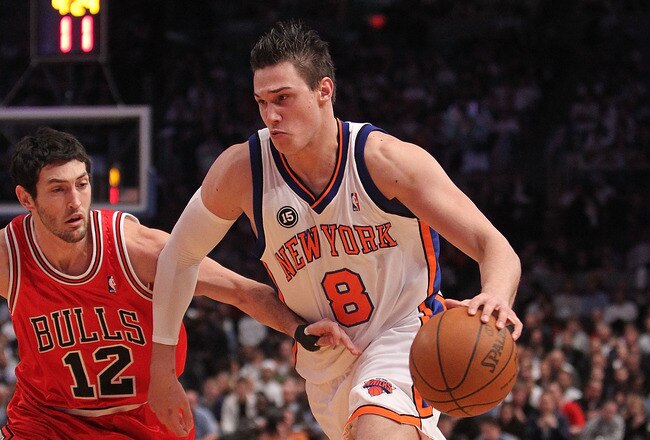 NEW YORK - FEBRUARY 17:  Danilo Gallinari #8 of the New York Knicks dribbles the ball against Kirk Hinrich #12 of the Chicago Bulls at Madison Square Garden on February 17, 2010 in New York, New York. NOTE TO USER: User expressly acknowledges and agrees that, by downloading and or using this photograph, User is consenting to the terms and conditions of the Getty Images License Agreement.  (Photo by Nick Laham/Getty Images)